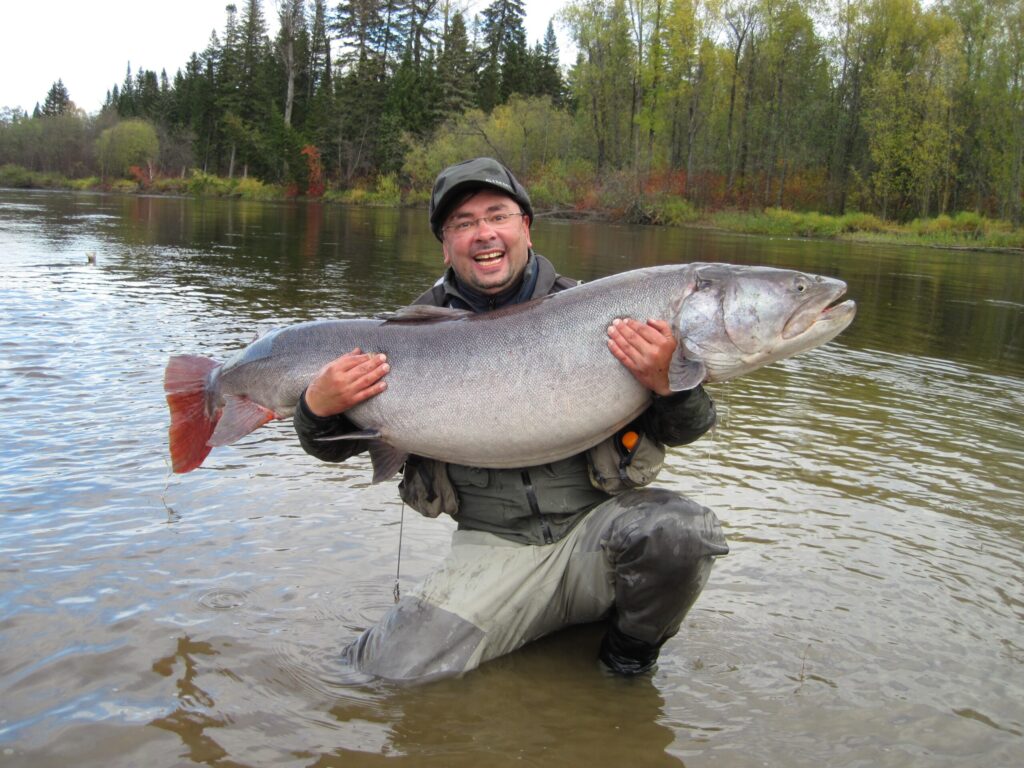 A fisherman showing proudly his results. After all this fisherman is comparable to a lucky Data Scientist who revels deep insights after data wrangling.