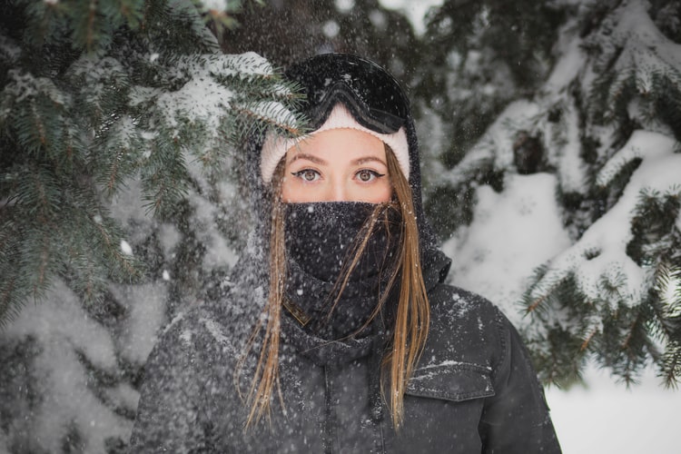 Woman with a mask during winter